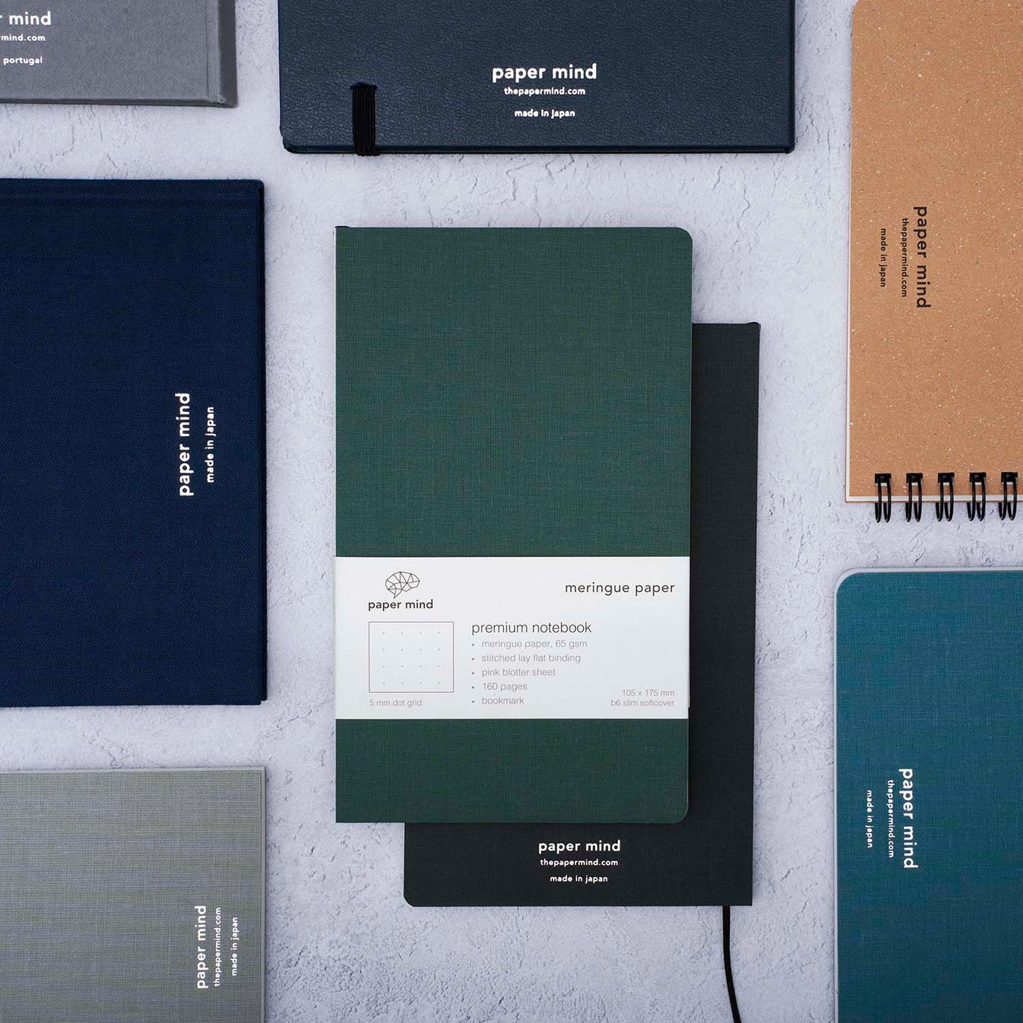 The Paper Mind Meringue Paper Notebook B6 Slim, Notebook for Fountain Pens, dot grid, green cover with past notebooks
