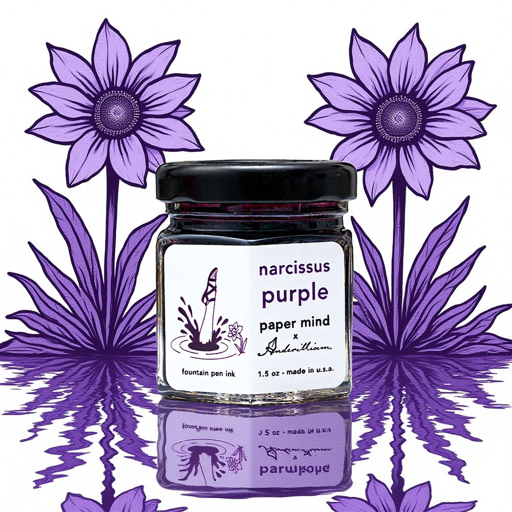 Jar of 'narcissus purple' ink with decorative purple flowers in the background The Paper Mind x Anderillium Fountain Pen Ink 1.5 oz Bottle - Narcissus Purple - Made in the USA