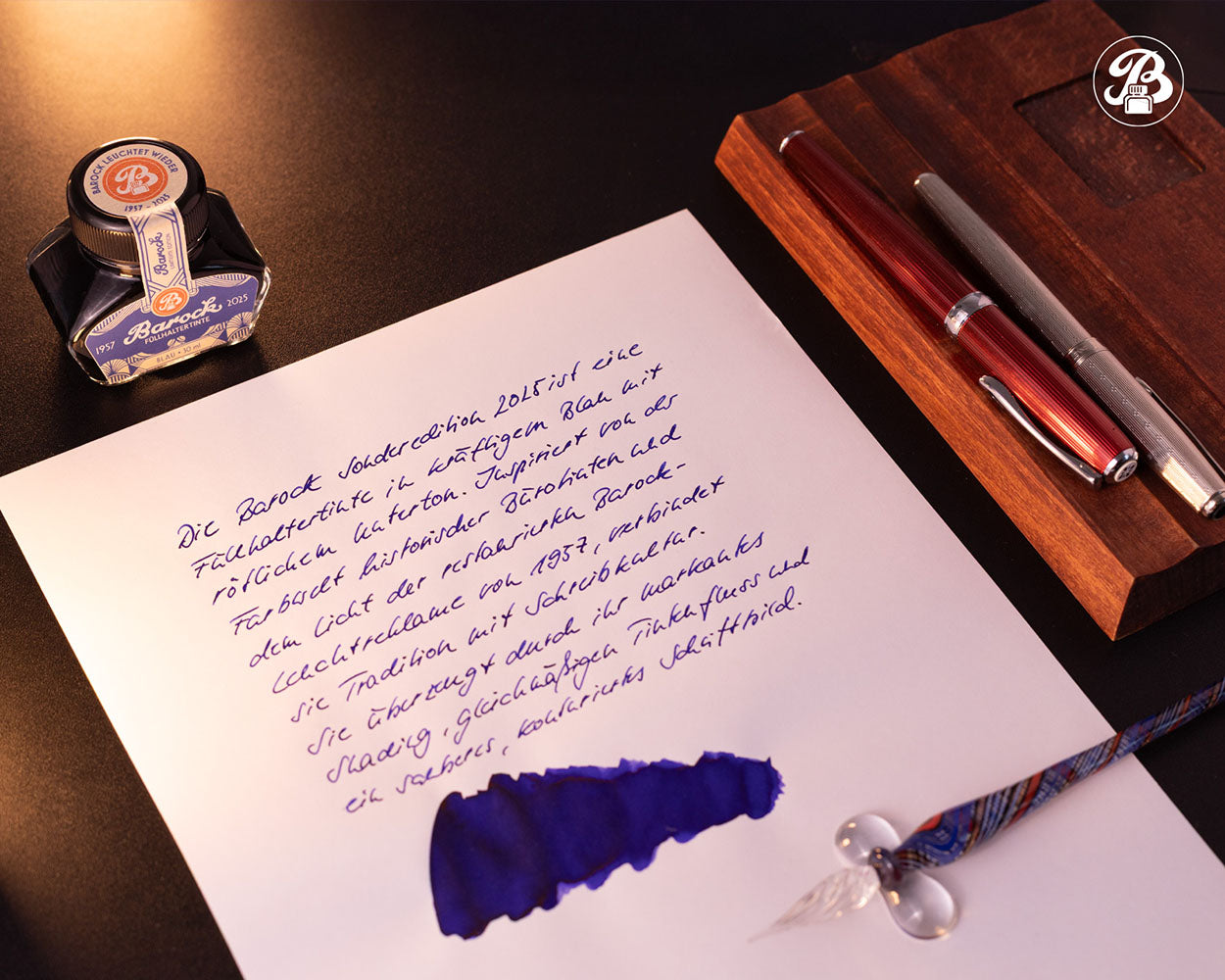 Inkwell, ink bottle, and writing on paper with a pen set in the background Octopus Fluids Barock Fountain Pen Ink - 30 ml Bottle - Blau Blue 2025 - Limited Edition