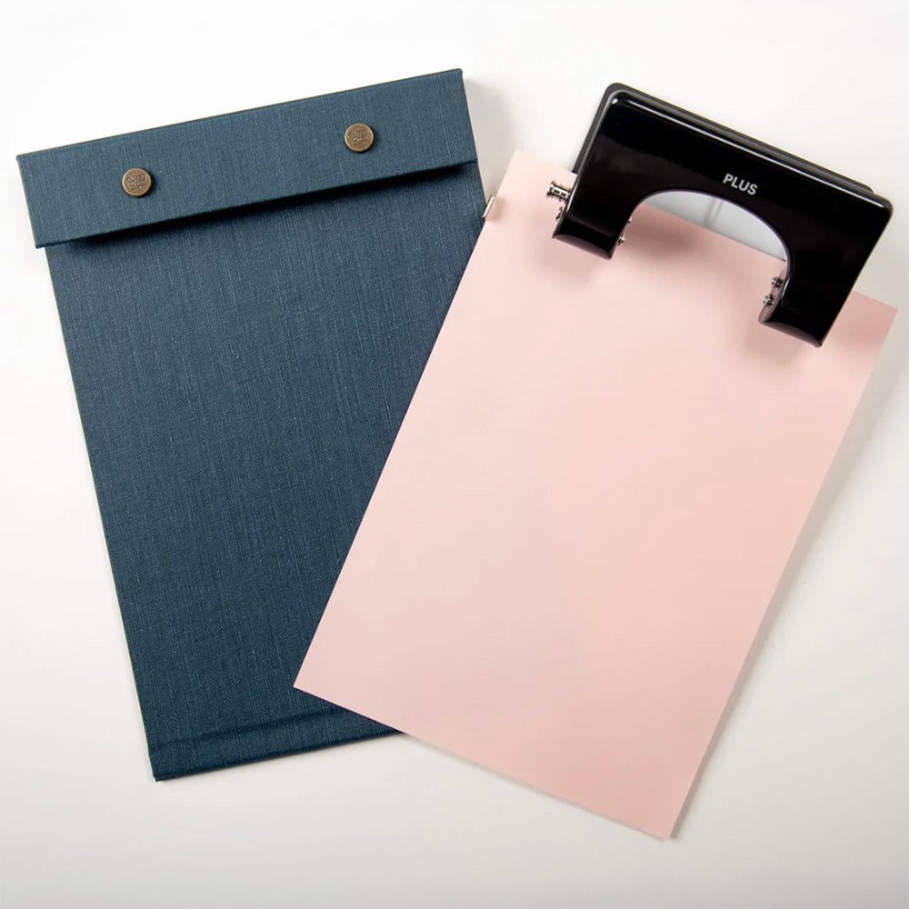 Postalco Snap Pad PLUS 2 hole punch black in action with snap pad